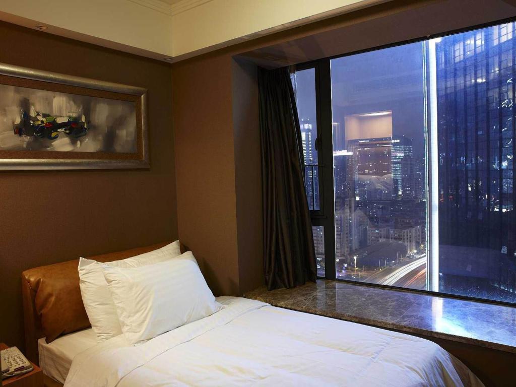 Dan Executive Hotel Apartment Zhujiang New Town Гуанджоу Стая снимка